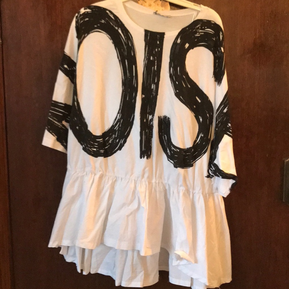 Black/white blouse- black writing on the front.